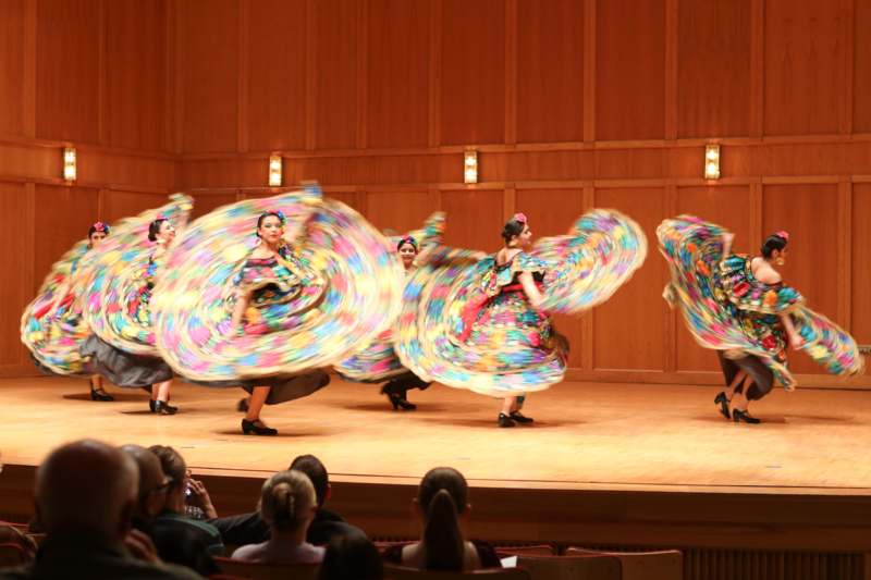 a group of women dancing on a stage