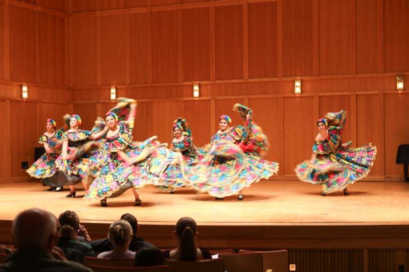 a group of women dancing on a stage