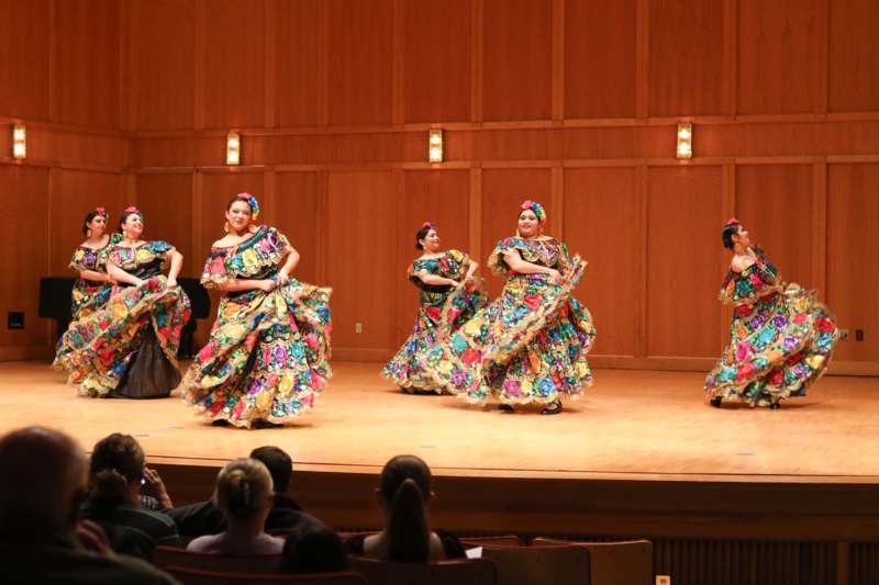 a group of women performing on a stage