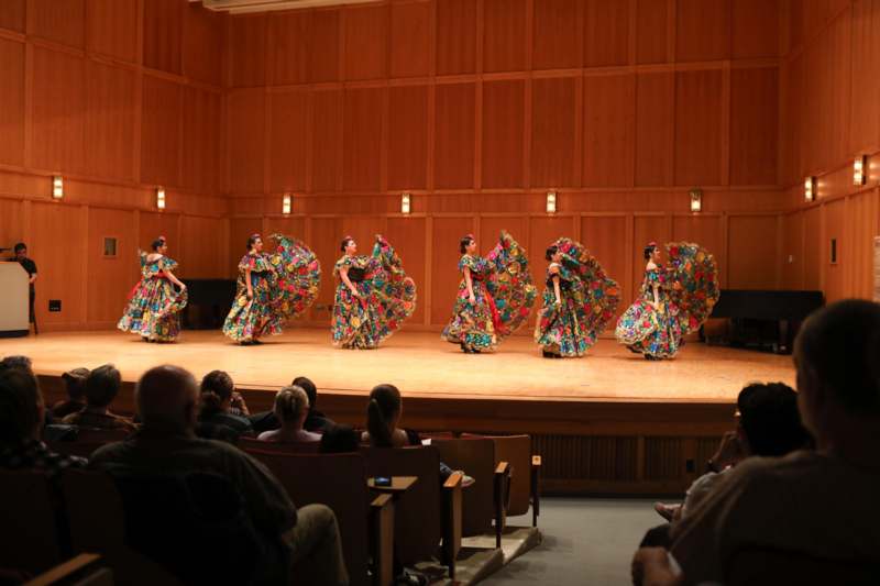 a group of women performing on a stage