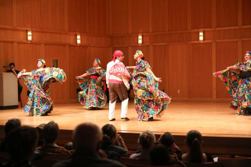 a group of people performing on a stage