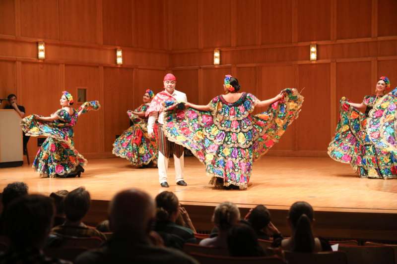 a group of people performing on a stage