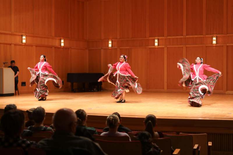 a group of women performing on a stage