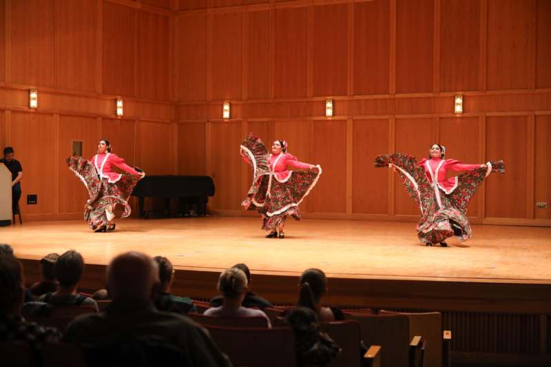 a group of women performing on a stage