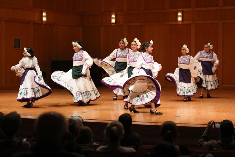 a group of women dancing on a stage