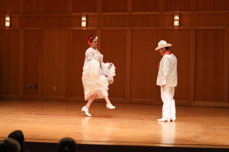 a man and woman on a stage