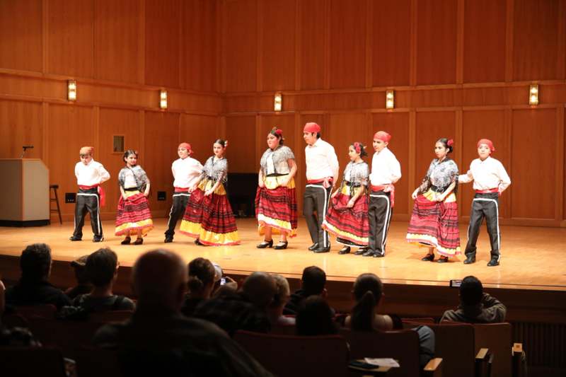a group of people performing on a stage
