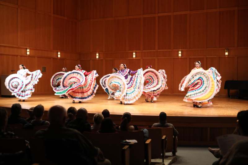 a group of women performing on a stage