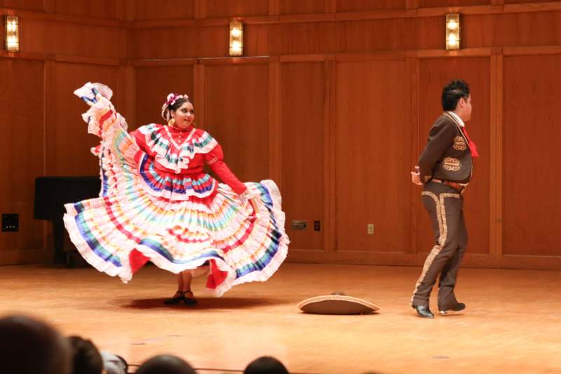 a man and woman dancing on a stage