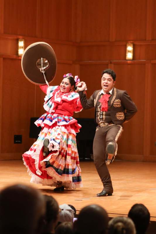 a man and woman dancing on a stage