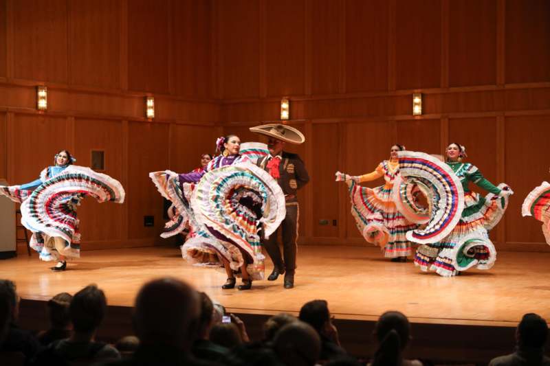 a group of people dancing on a stage