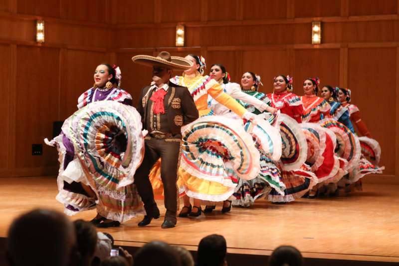 a group of people in clothing on a stage