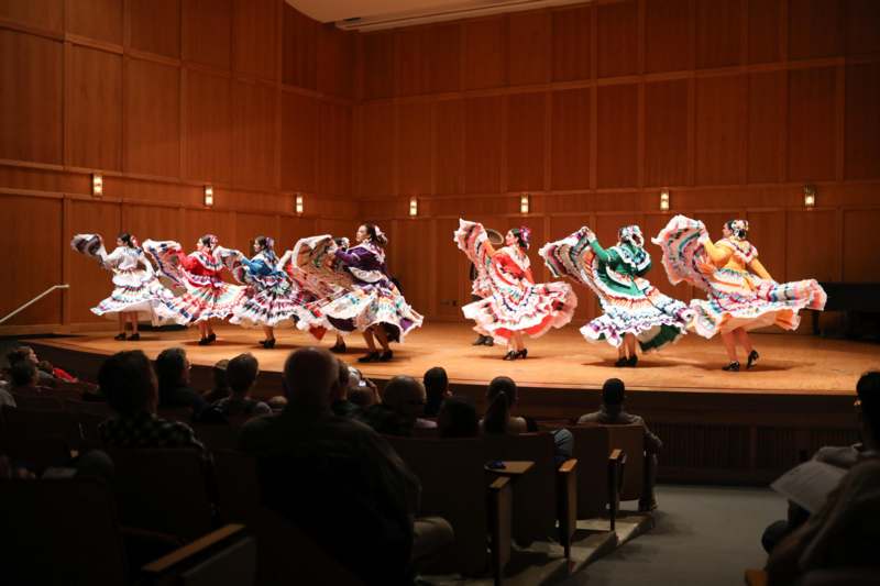 a group of women dancing on a stage