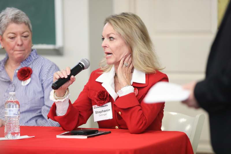 a woman speaking into a microphone
