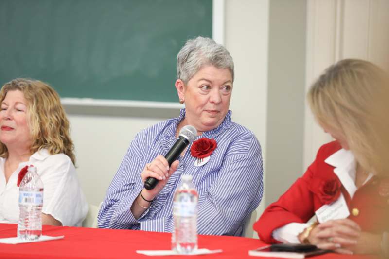 a woman speaking into a microphone