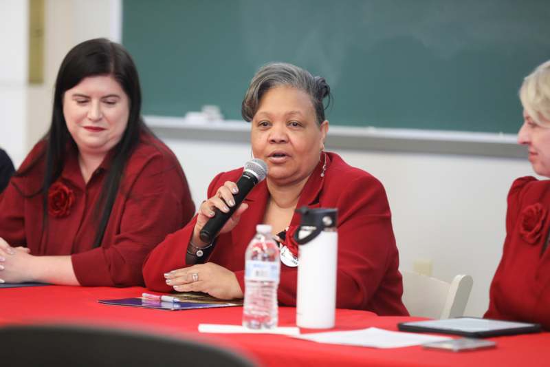 a woman speaking into a microphone