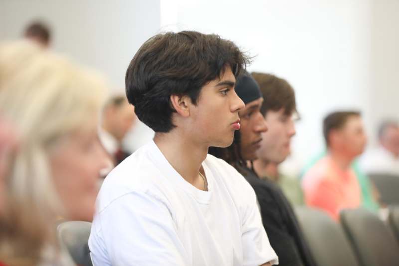 a group of people sitting in chairs