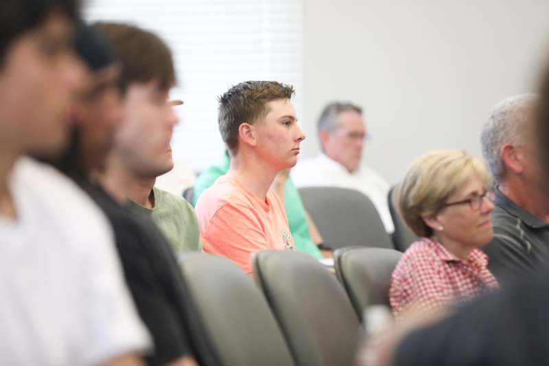 a group of people sitting in chairs