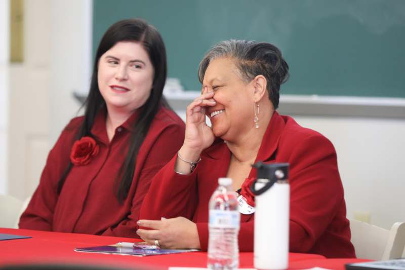 a woman laughing at another woman