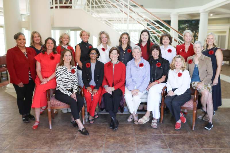 a group of women posing for a photo