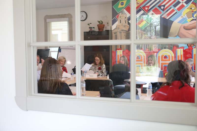 a group of people sitting at a table