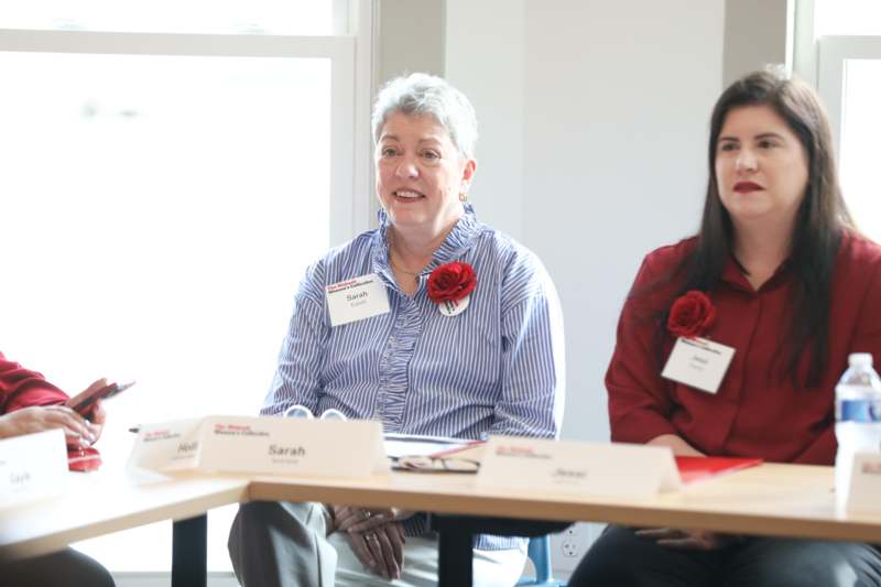 a group of women sitting at a table
