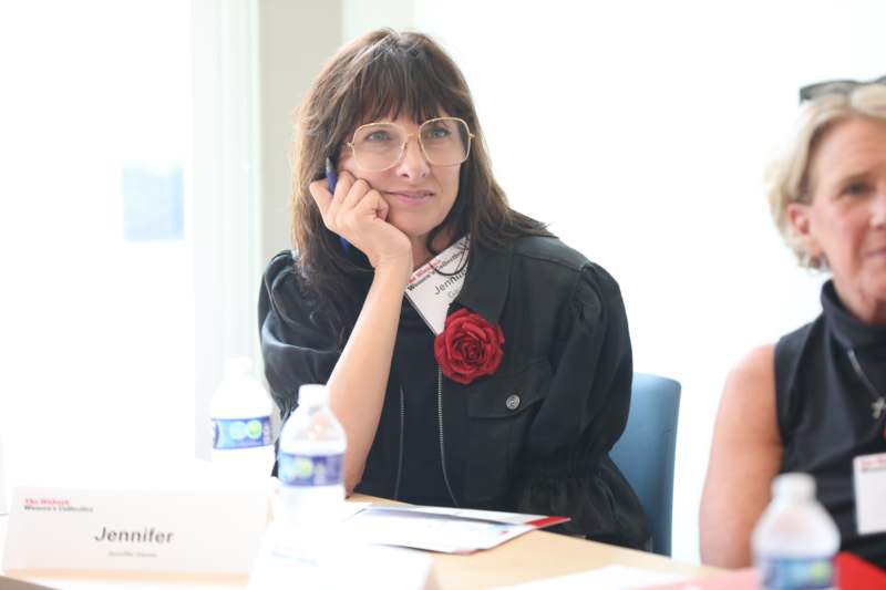 a woman sitting at a table