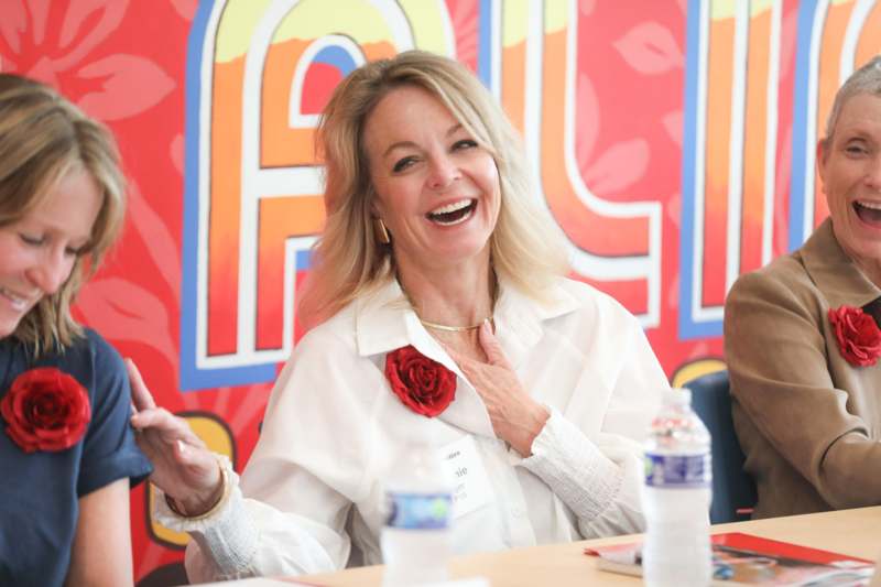 a woman laughing at a man