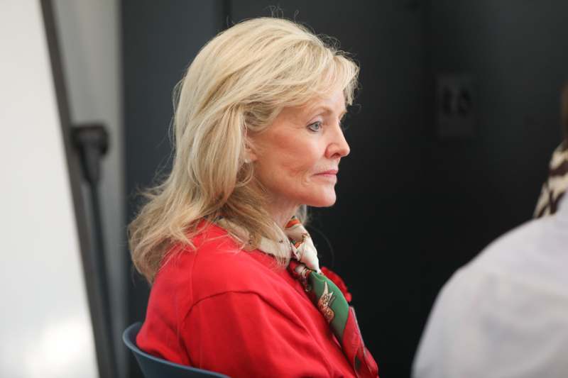 a woman in a red shirt