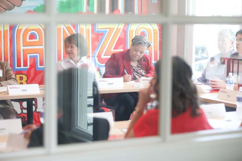 a group of women sitting at a table