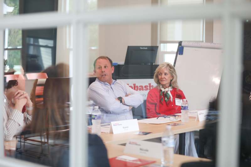 a man and woman sitting at a table