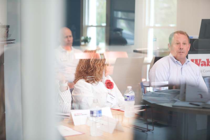 a group of people sitting at a table