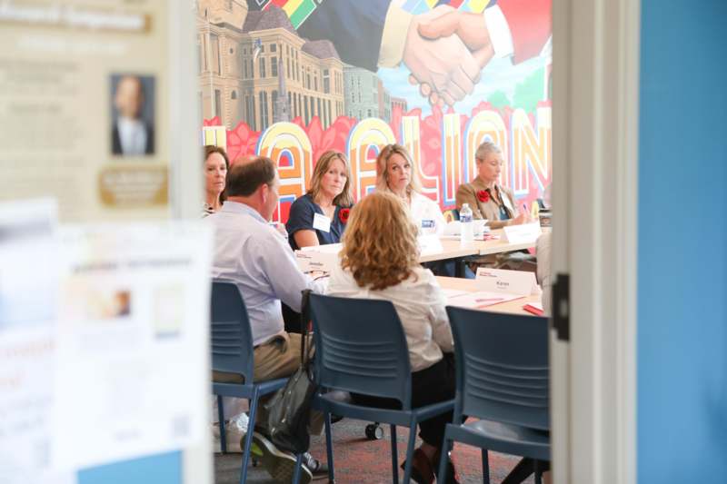 a group of people sitting at a table