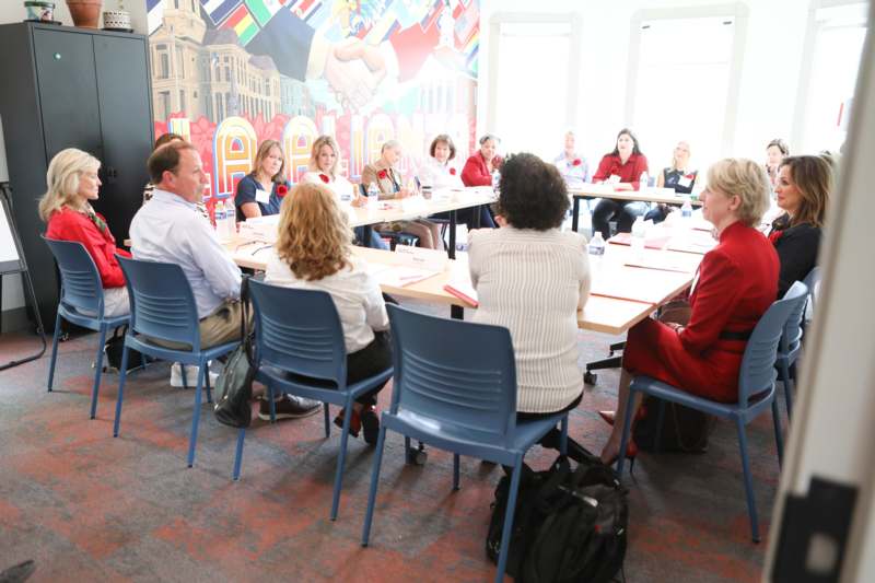 a group of people sitting around a table