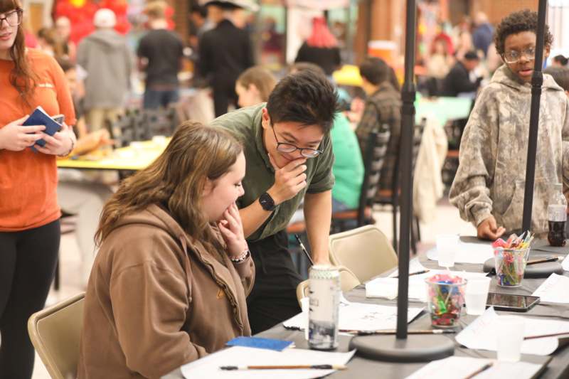 a man and woman sitting at a table