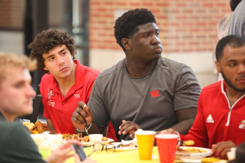 a group of people sitting at a table