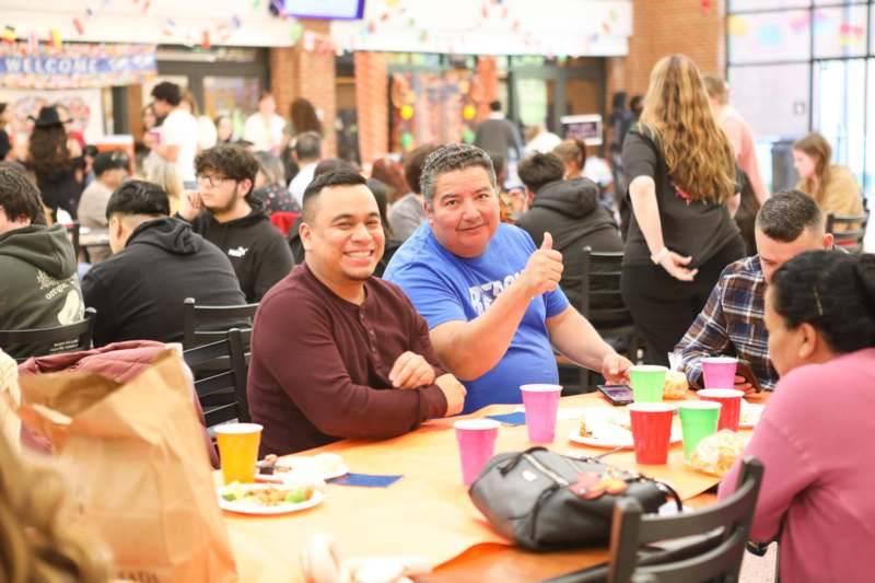 a group of people sitting at a table