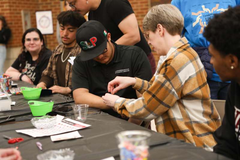 a group of people sitting at a table