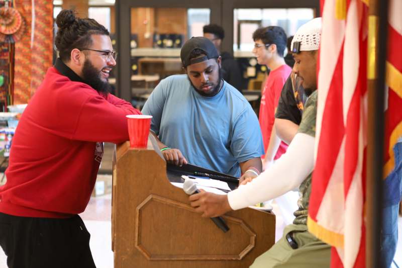 a group of men standing behind a podium