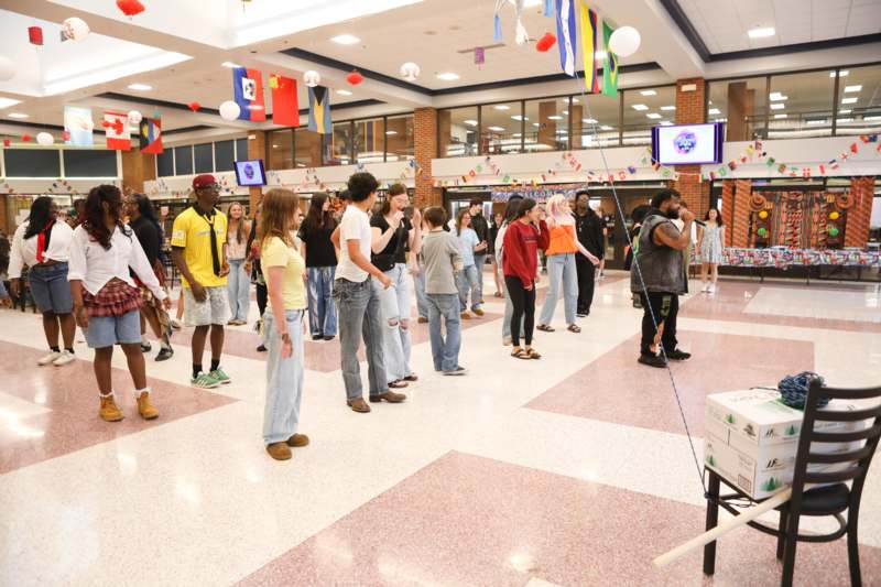 a group of people standing in a room
