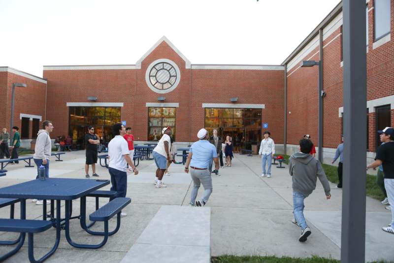 a group of people outside a building