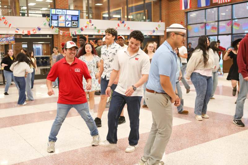 a group of people dancing in a room