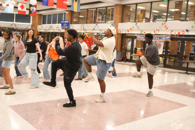 a group of people dancing in a gym