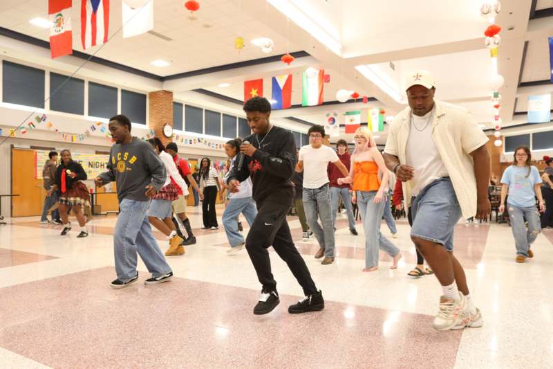a group of people dancing in a room