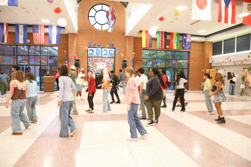 a group of people in a hall