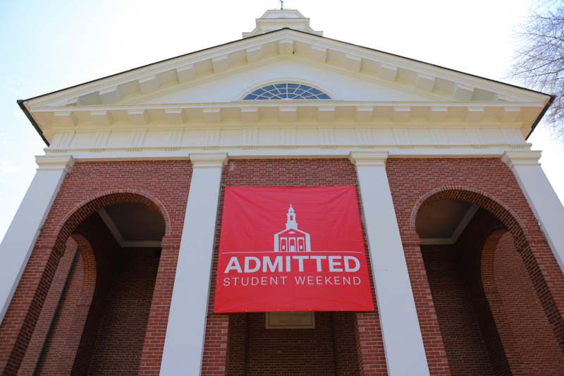 a red banner on a brick building