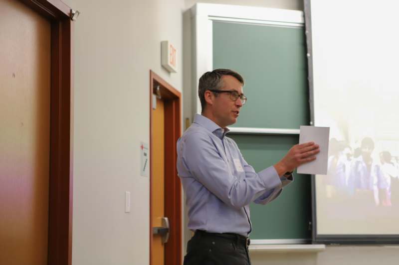 a man holding a piece of paper