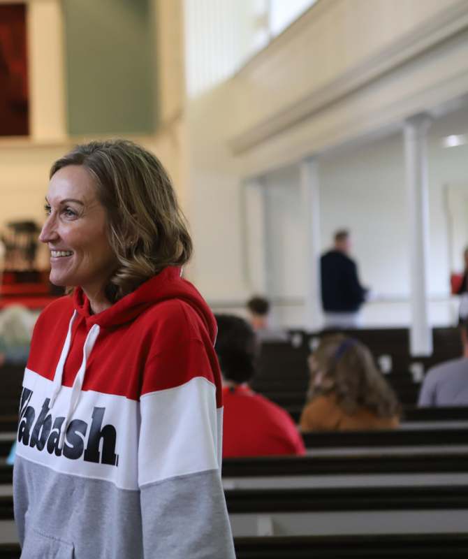 a woman in a red and white sweatshirt