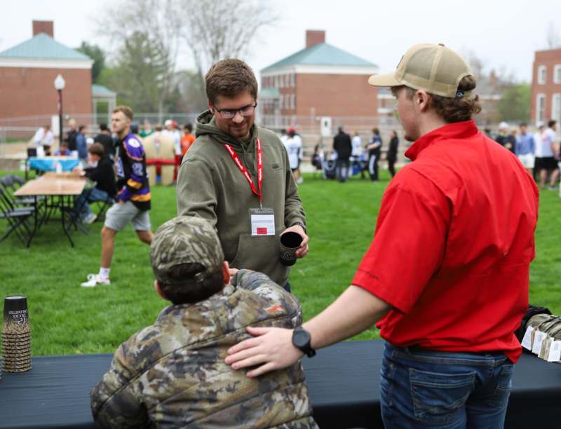 a group of people standing on a bench
