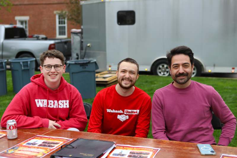 a group of men sitting at a table
